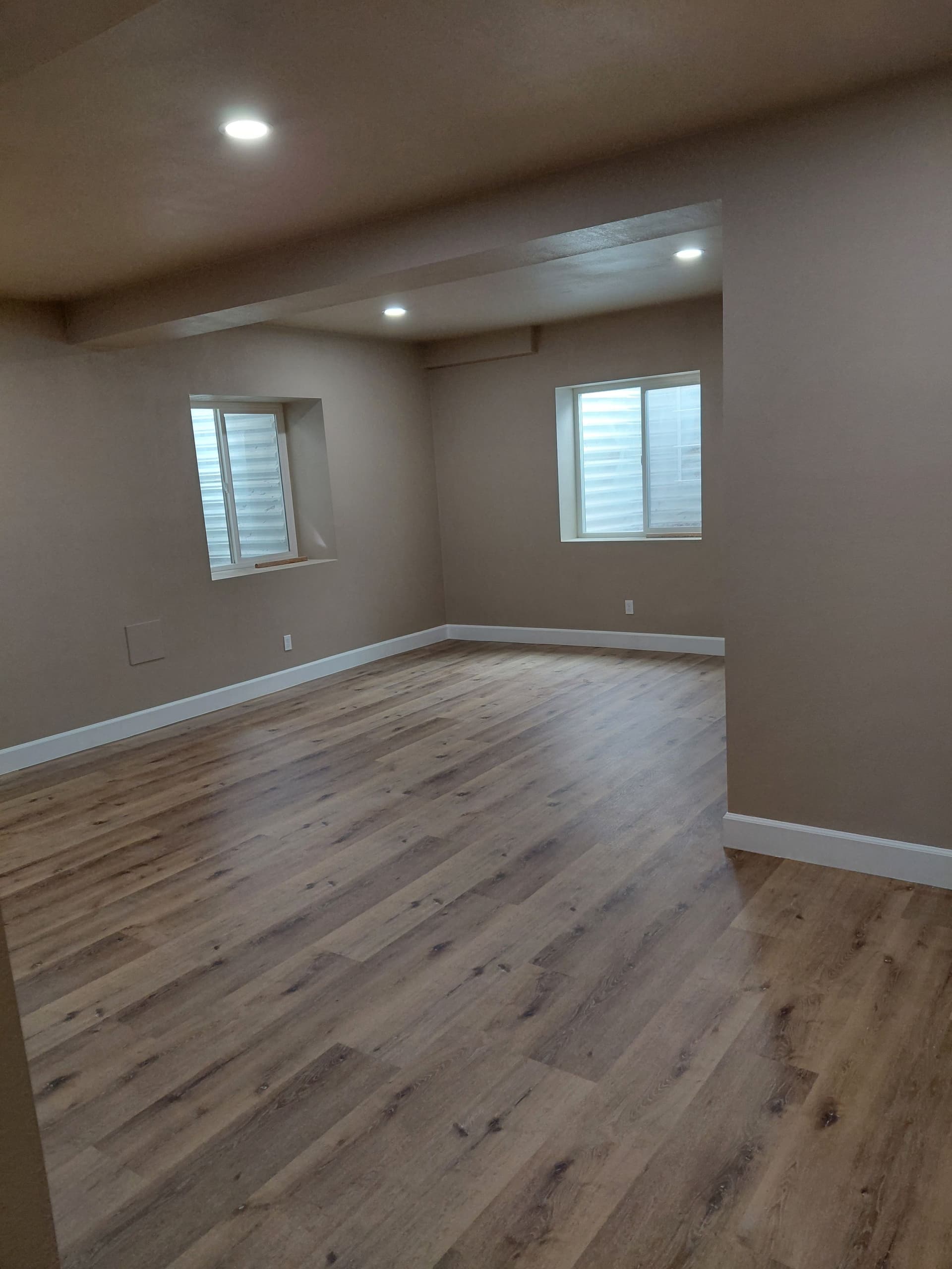 Beautiful Basement Makeover with New Flooring and Stylish Trim image