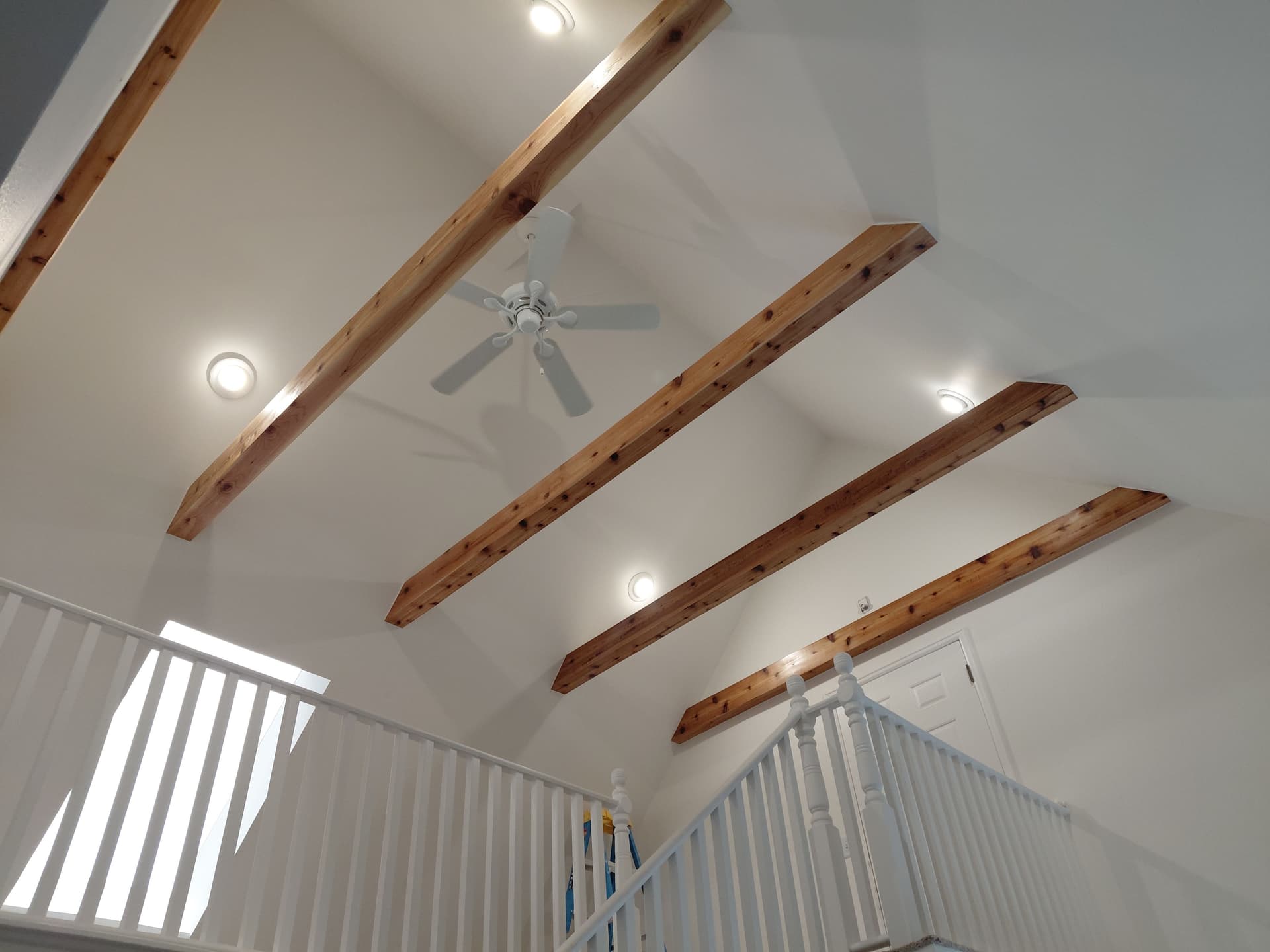 Cedar Beam Ceiling Upgrade with Smooth Finish and Recessed Lighting image