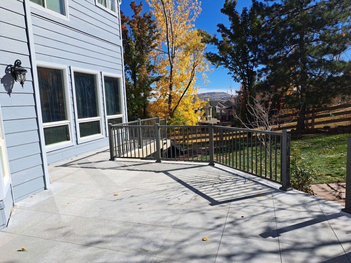 Elegant Outdoor Spaces with Grey Tile Patios image